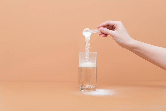 zeolite powder being added to glass of water